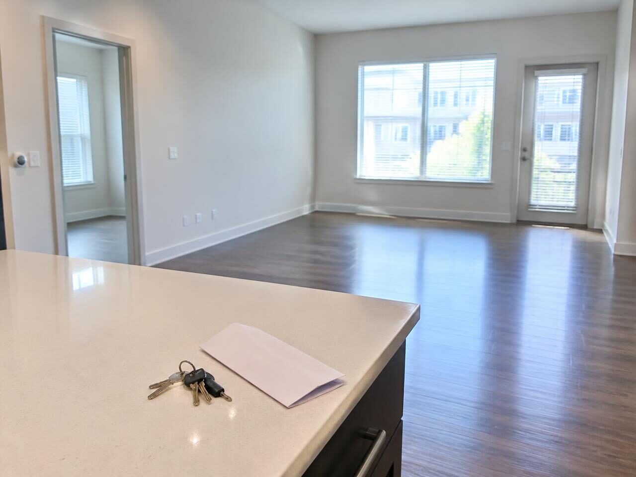 Clean empty apartment with keys on the counter